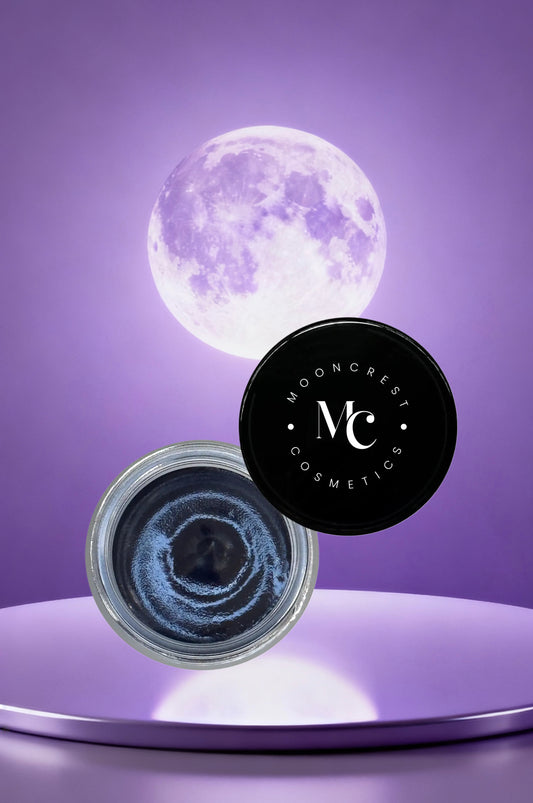 Cosmetic jar with black lid featuring 'Mooncrest Cosmetics' logo, against a purple background with a full moon.