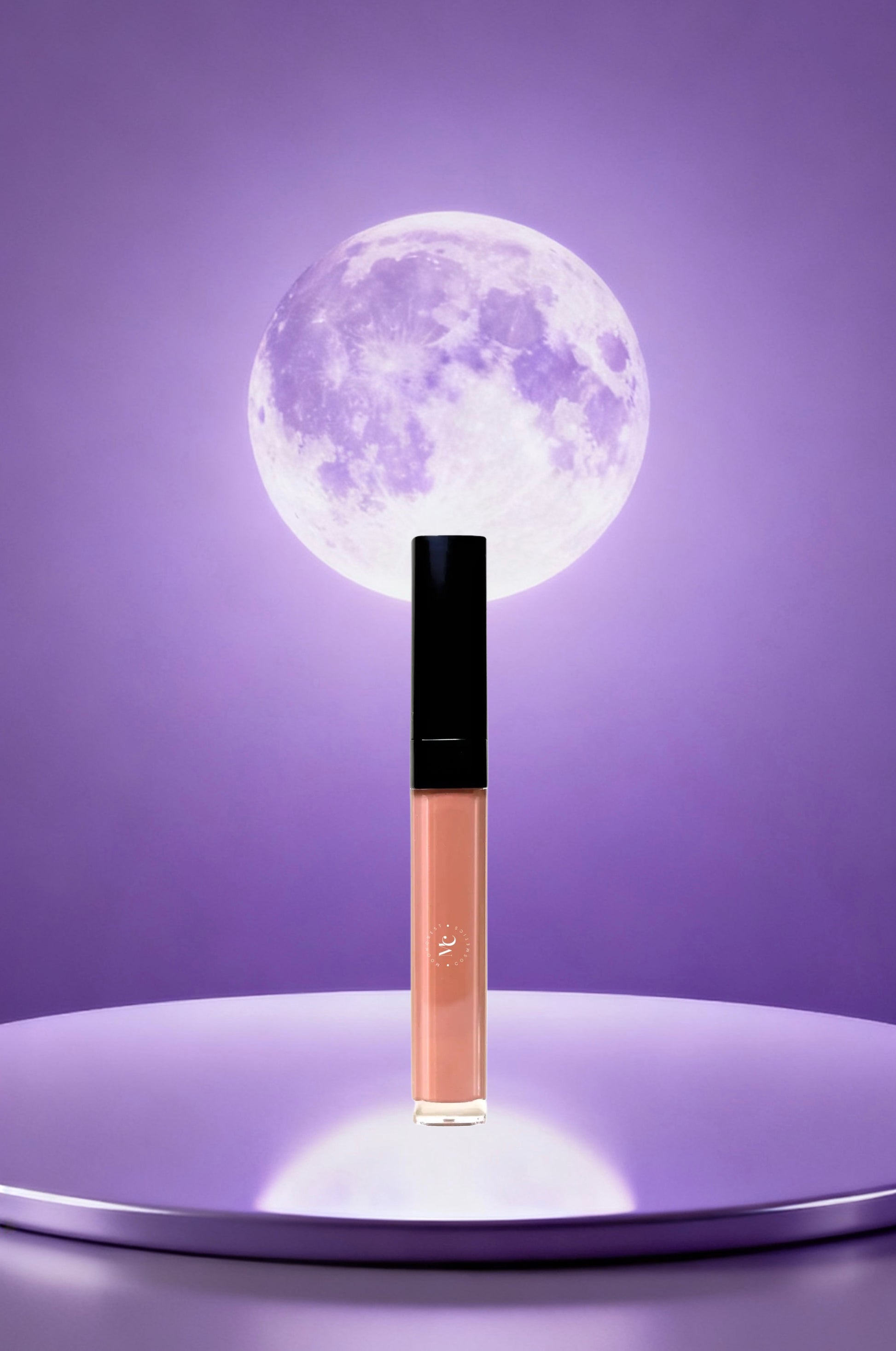 Lip gloss with a moon-like design on a purple background